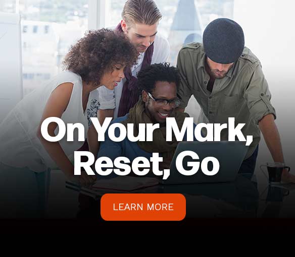 group of people in front of a laptop