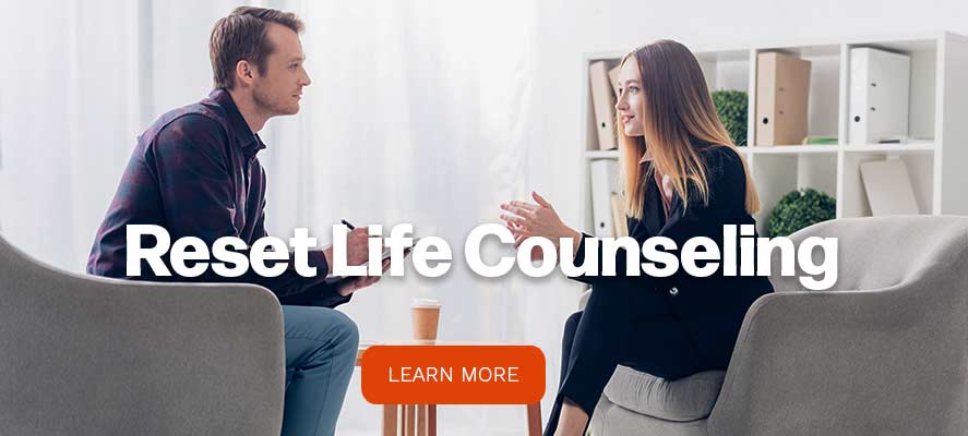 photo of a man and woman talking in an office